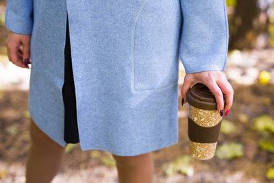 Midsection of child holding ice cream cone