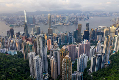 Aerial view of modern buildings in city against sky