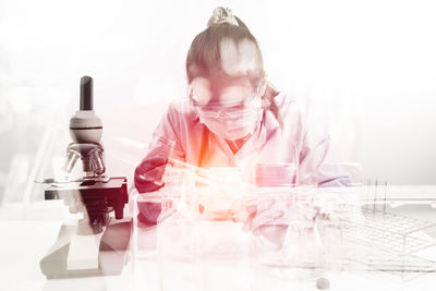 Double exposure of female doctor in laboratory