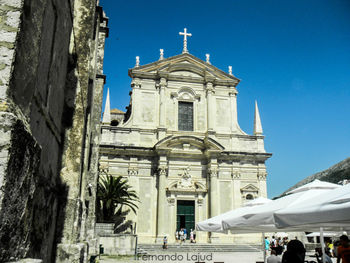 Low angle view of church against blue sky