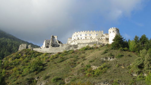 View of castle on mountain against sky