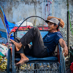 Young man sitting on chair