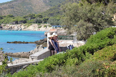 Scenic view of sea with mountain in background