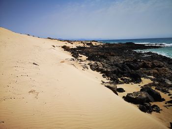 Scenic view of beach against sky