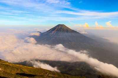 View of volcanic landscape against cloudy sky