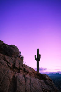 Low angle view of rocks against sky during sunset