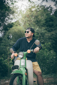 High angle view of man riding sunglasses on trees