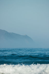 Scenic view of sea against sky during winter