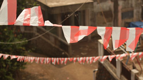 Red flags hanging on clothesline