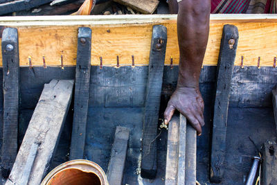 Low section of person working on wood