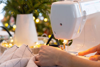 Cropped hands sewing machine