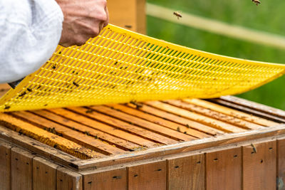 Cropped image of man working on wooden table