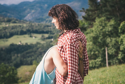 Close-up of woman standing on bench