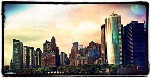 City skyline against cloudy sky