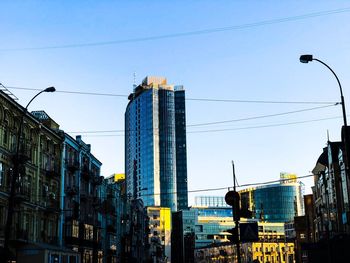 Buildings against blue sky in city