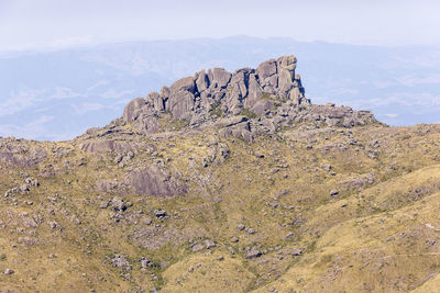 Rock formations on mountain against sky