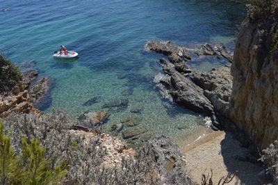 High angle view of rocks in sea