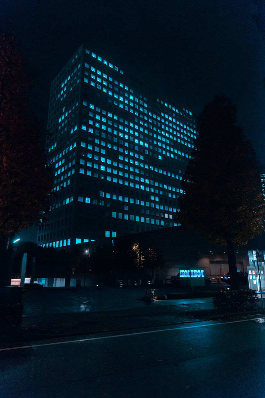 ILLUMINATED MODERN BUILDING AT NIGHT