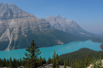 Scenic view of mountains against blue sky