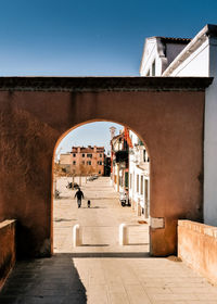 Arch on walkway in town at lido di venezia