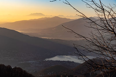 Scenic view of silhouette mountains against sky at sunset