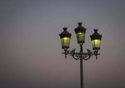 Low angle view of street light against clear sky