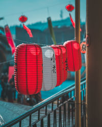 Close-up of lantern hanging on railing
