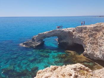 Scenic view of sea against clear blue sky