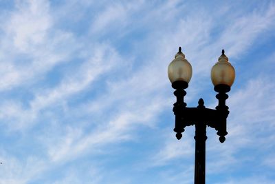 Low angle view of street light against sky