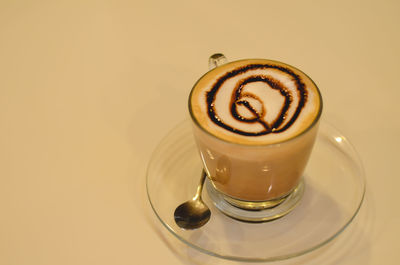 Close-up of coffee cup on table