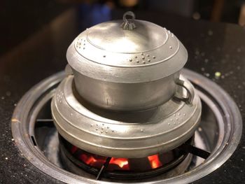 Close-up of container on stove