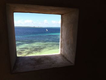 View of sea seen through window