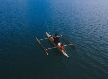 High angle view of people on boat sailing in sea