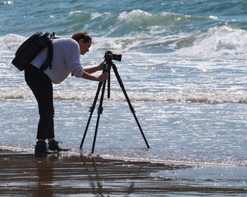 Man photographing at beach