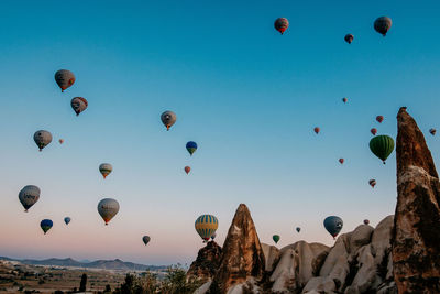 Low angle view of hot air balloons in sky