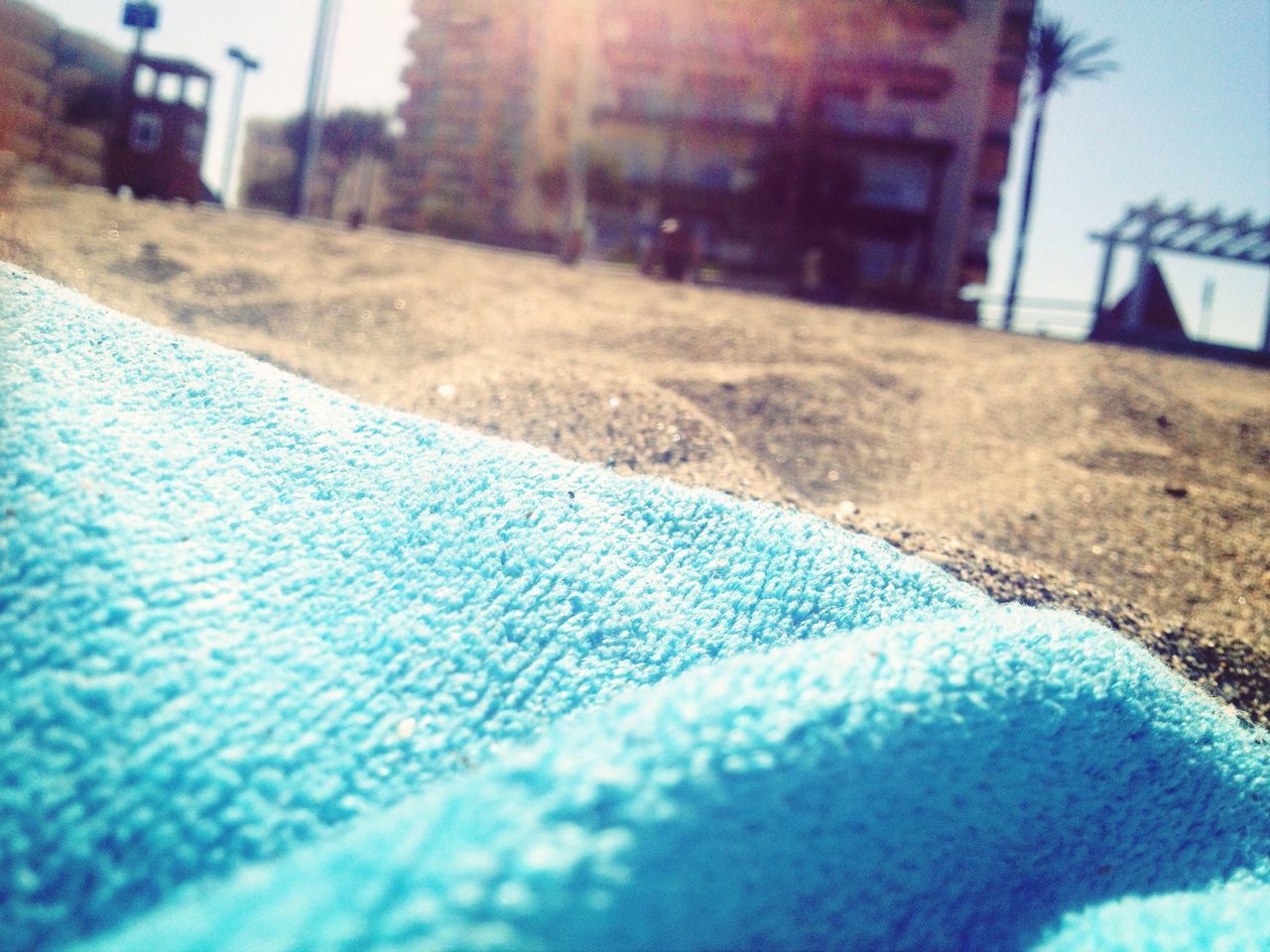 blue, selective focus, focus on foreground, close-up, surface level, built structure, building exterior, architecture, day, sunlight, outdoors, part of, focus on background, window, no people, street, metal, swimming pool, transportation, water