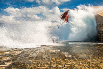 Man splashing water in sea