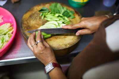 Cropped hand of person preparing food