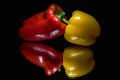 Close-up of bell peppers against black background