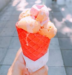 Person holding ice cream cone