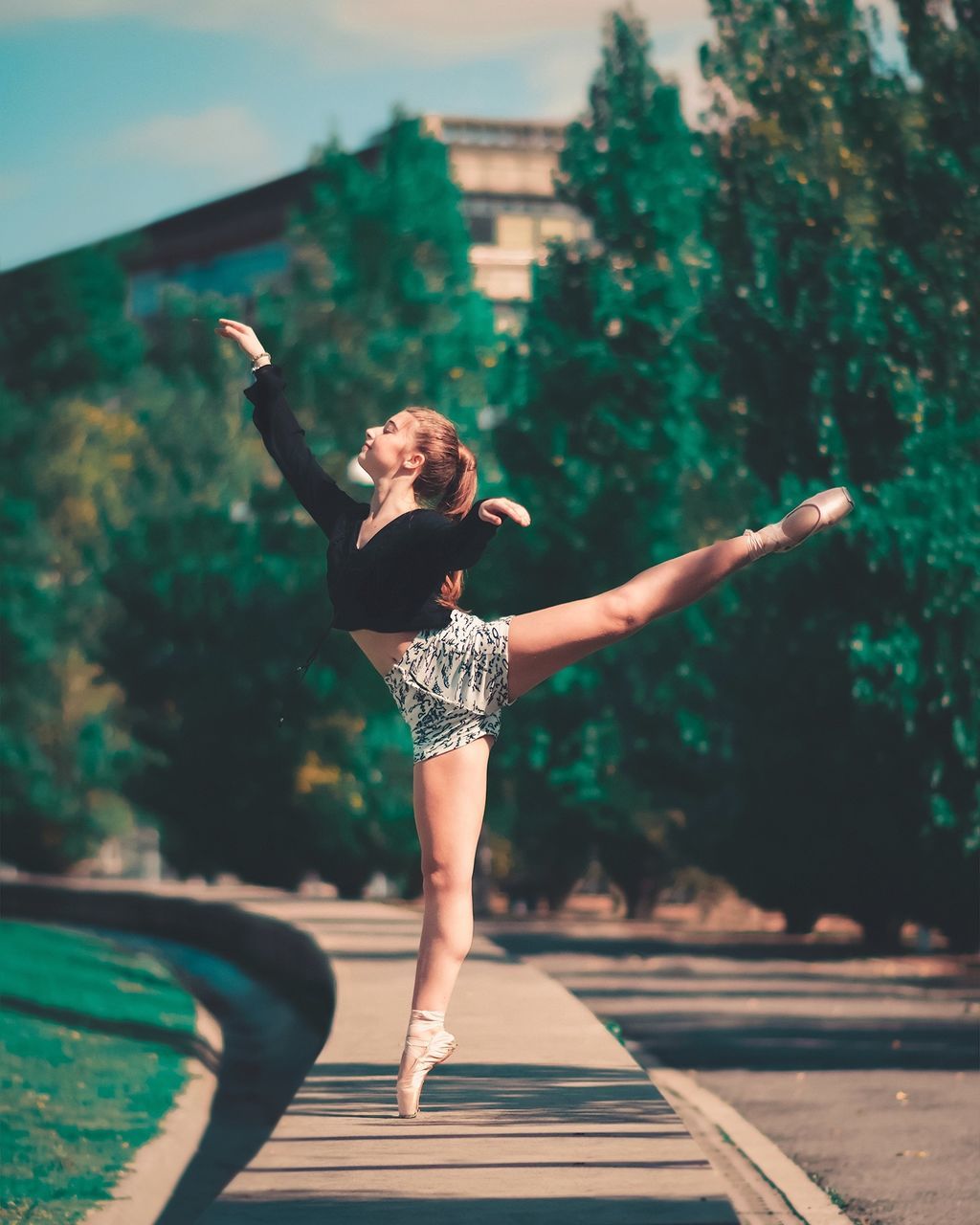 human arm, one person, full length, arms outstretched, limb, real people, lifestyles, women, standing, young adult, arms raised, leisure activity, young women, adult, nature, clothing, day, architecture, outdoors, hairstyle