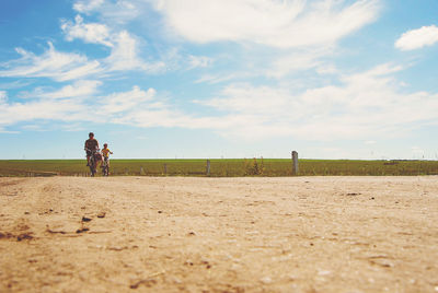 Full length of man on field against sky