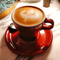 High angle view of cappuccino on table