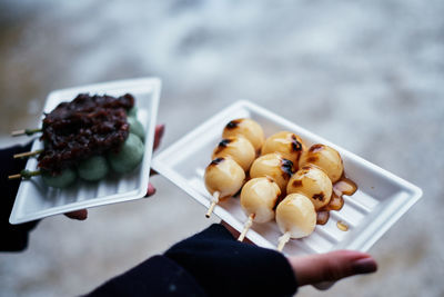 High angle view of person holding food in plate