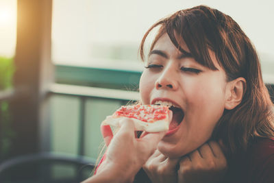 Portrait of woman eating food