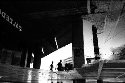 People walking on bridge