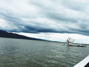 Scenic view of sea against cloudy sky