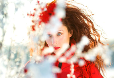 Portrait of a girl with red hair in winter