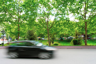 Blurred motion of car on road in city