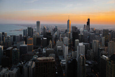 Aerial view of city at sunset